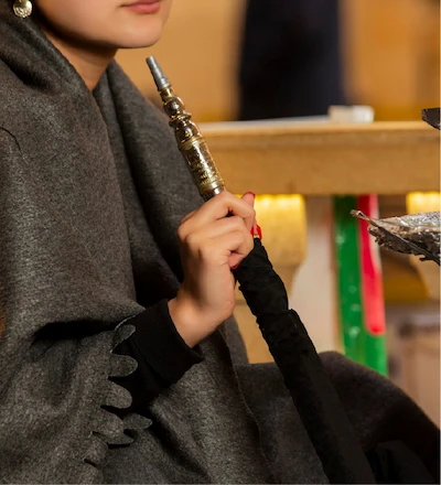 Women Holding Shisha